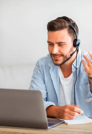  Man talking on a laptop.