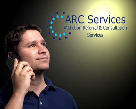  Man on cell phone with ARC logo.