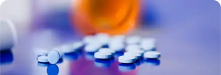 A bottle with barbiturate pills out of the bottle