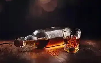  A man drinking alone.